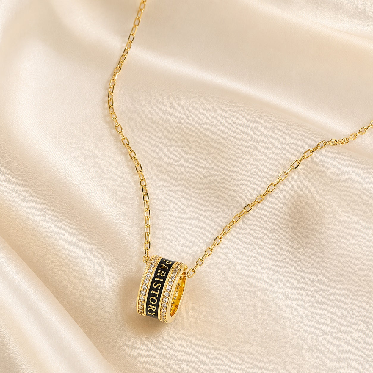 PARISTORY Gold-Tone Ring Pendant Necklace with Black Enamel and Sparkling Accents